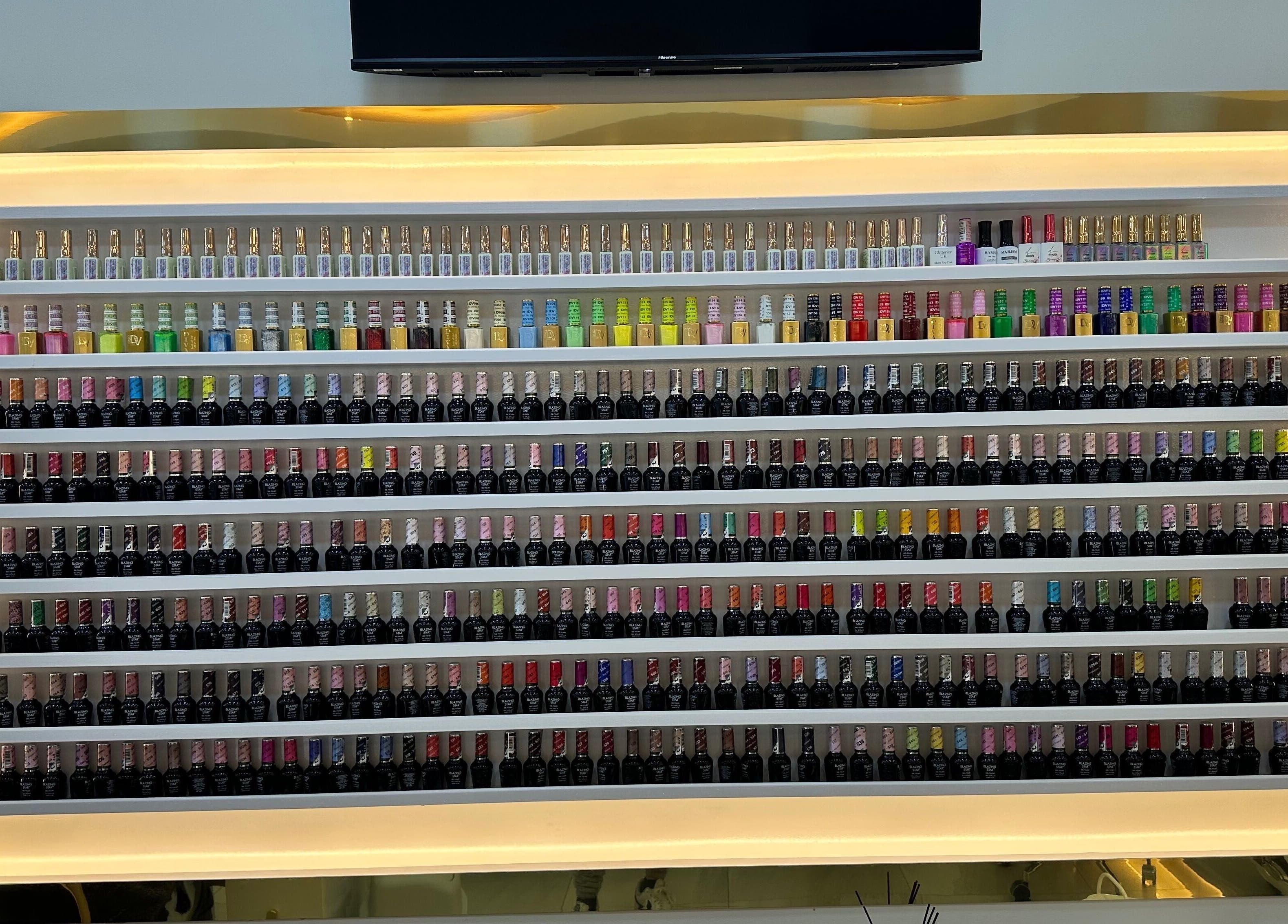 Colorful nail polish display at Happy Nails Doncaster in Doncaster, England, GB, showcasing a vibrant selection.
