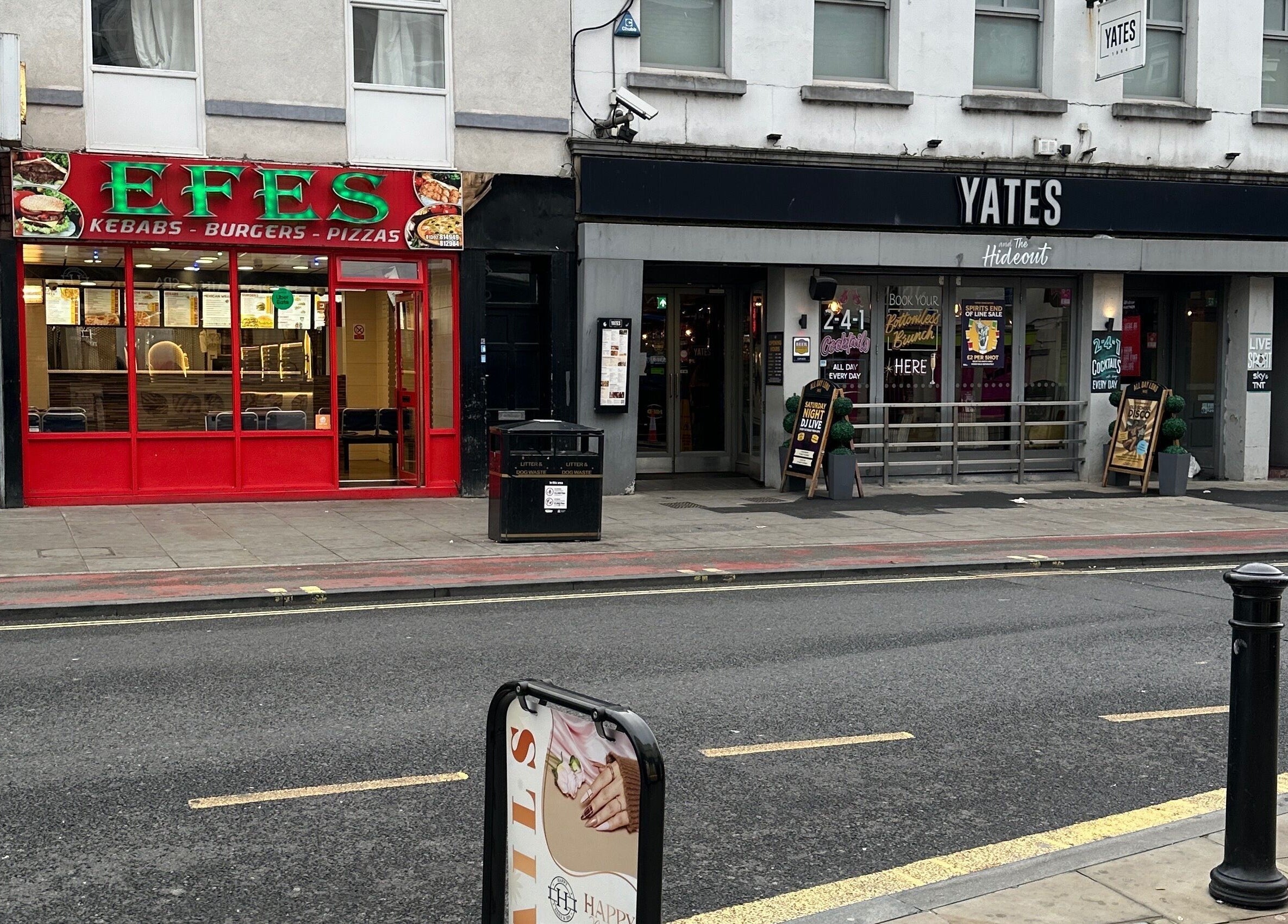 Street view of Happy Nails Doncaster, situated in Doncaster, England, GB, showcasing nearby buildings.