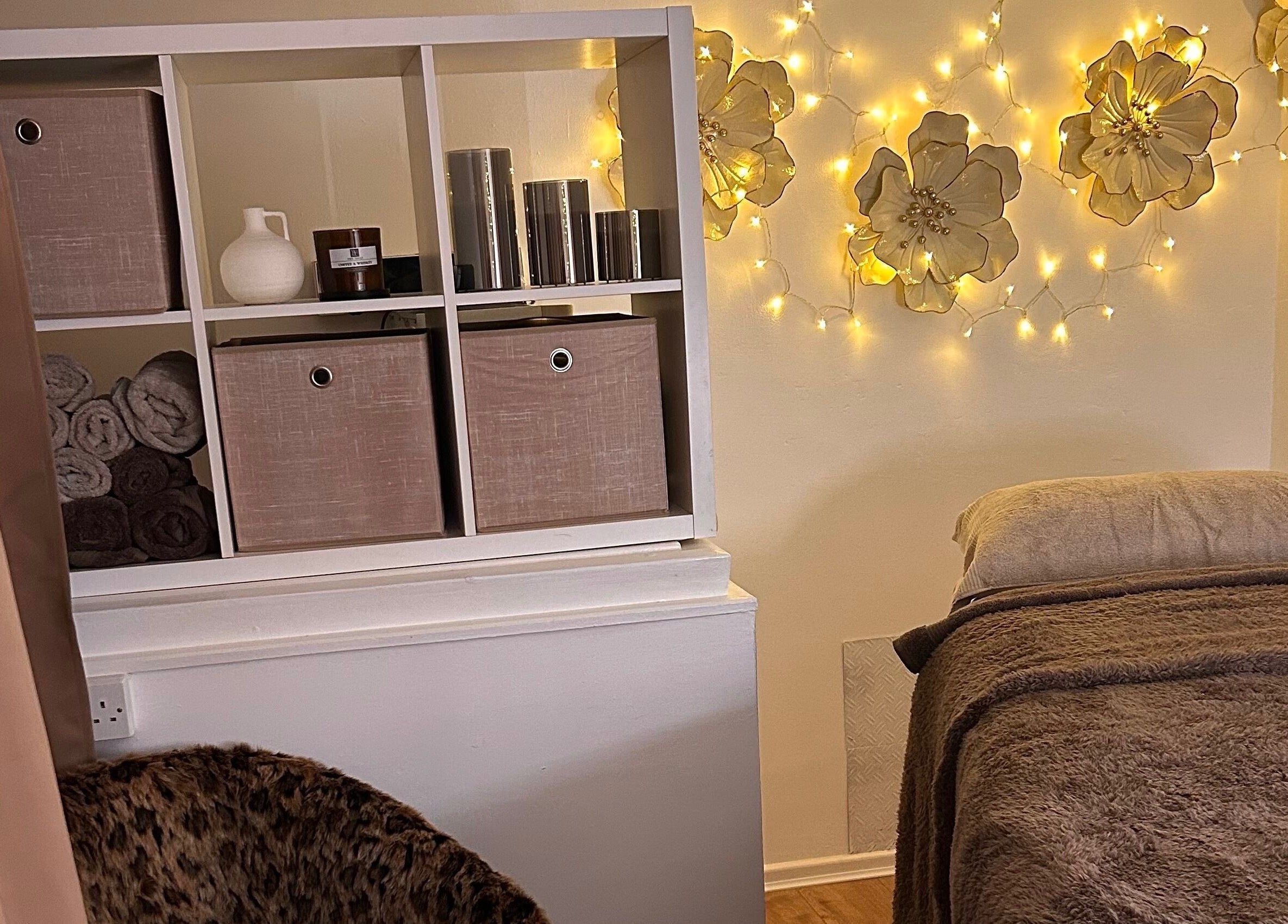 Relaxing treatment room at Olivia Skin And Beauty, Worcester, England, featuring warm lighting and serene decor.