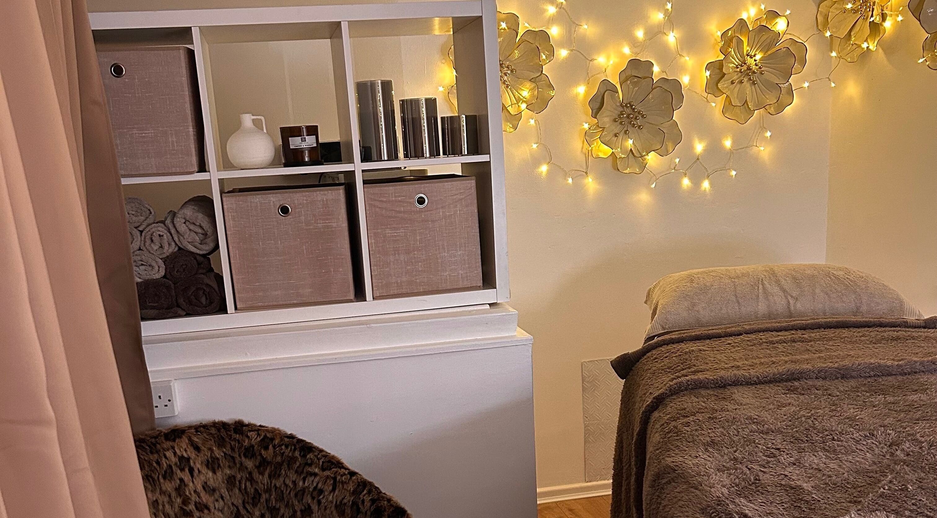 Relaxing treatment room at Olivia Skin And Beauty, Worcester, England, featuring warm lighting and serene decor.