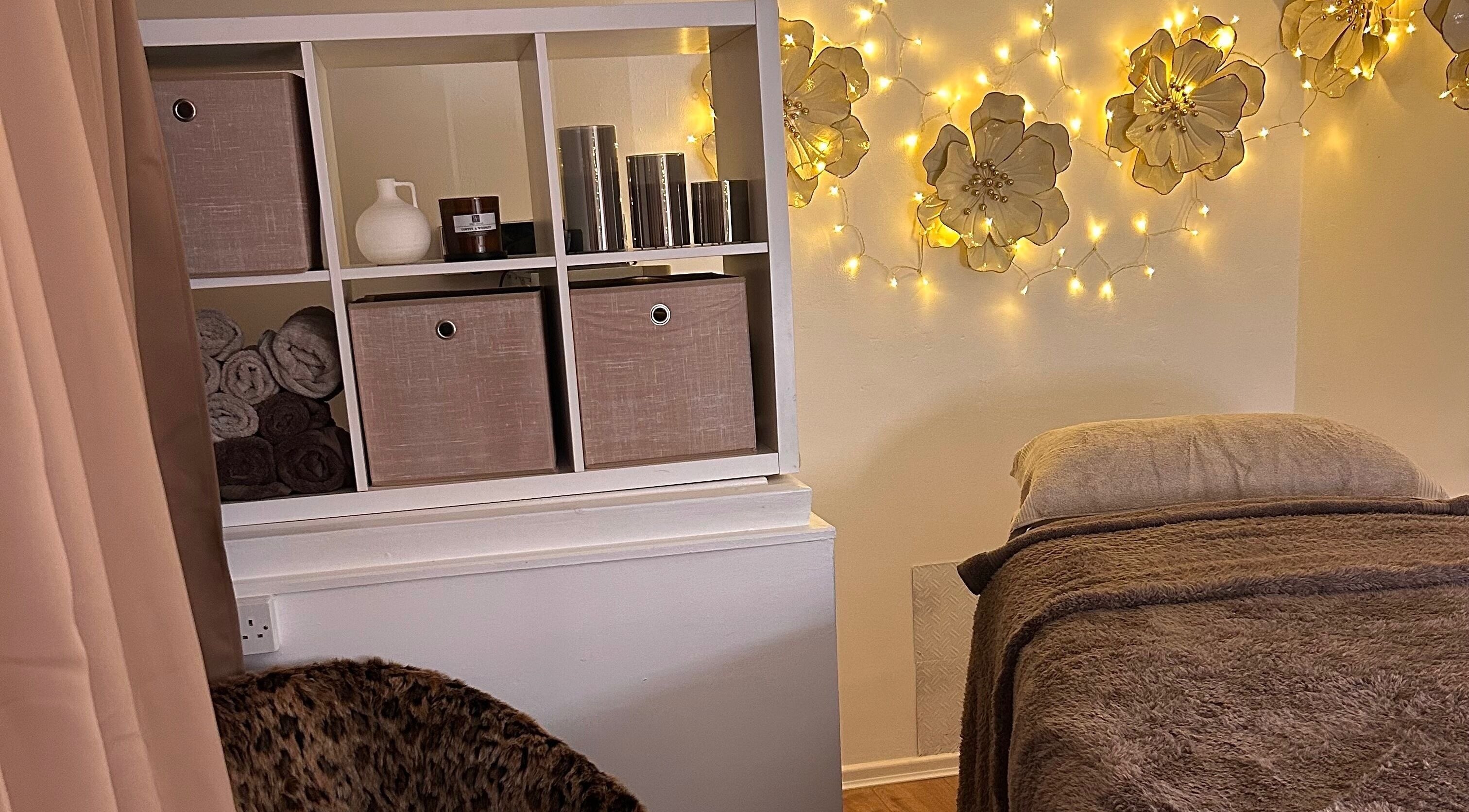 Relaxing treatment room at Olivia Skin And Beauty, Worcester, England, featuring warm lighting and serene decor.