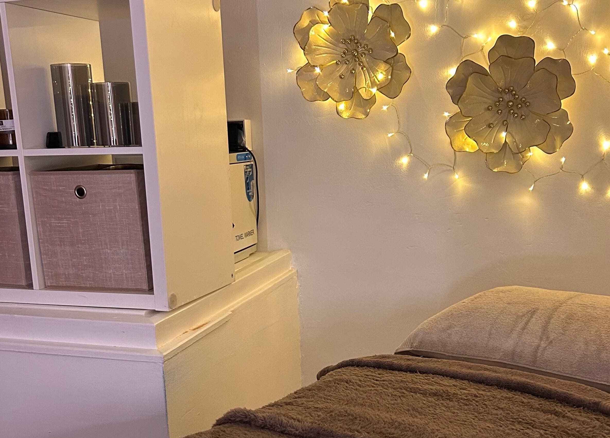 Elegant spa room with warm lighting at Olivia Skin And Beauty Worcester, England, GB, enhancing relaxation.