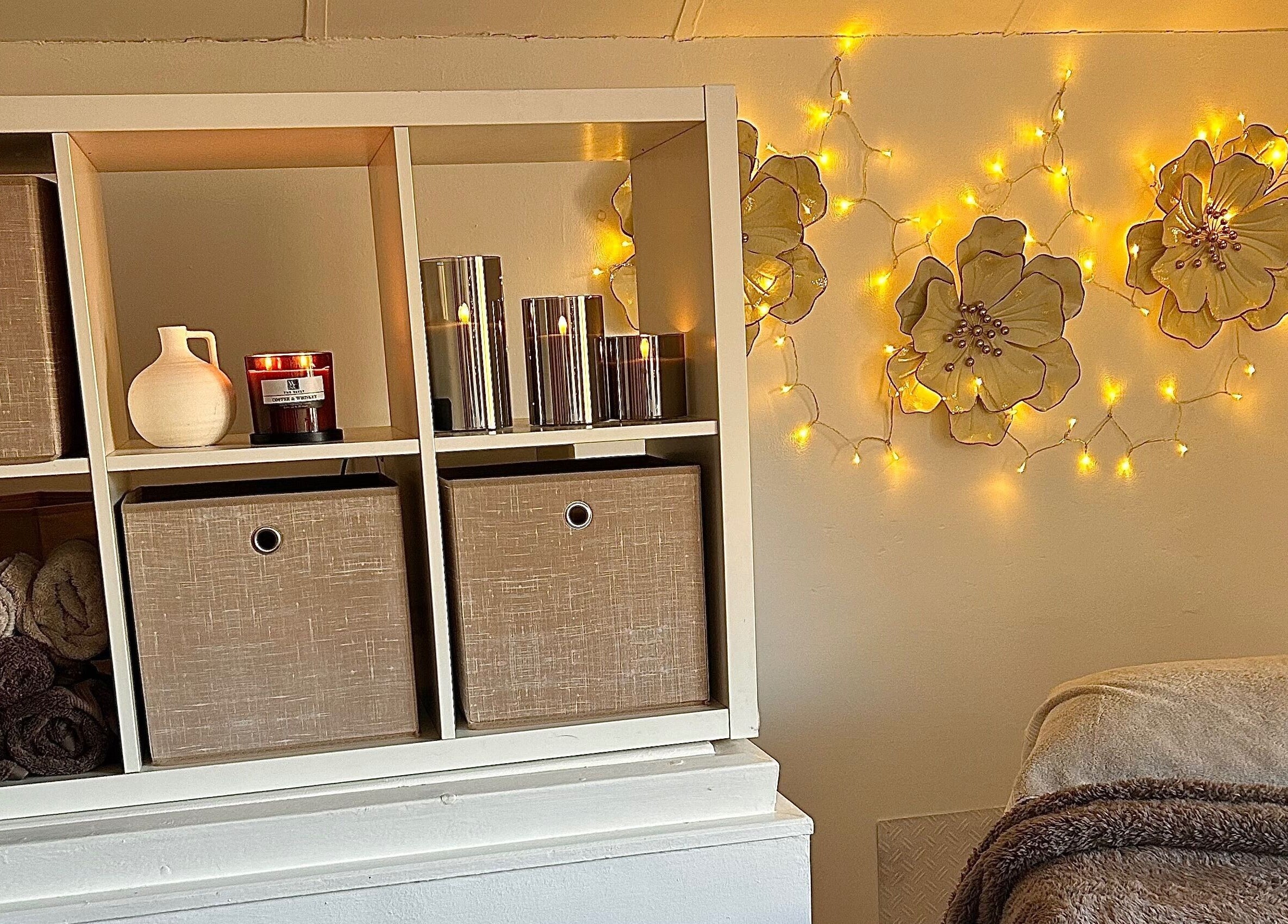 Cozy spa decor with candles and fairy lights at Olivia Skin And Beauty, Worcester, England, GB.