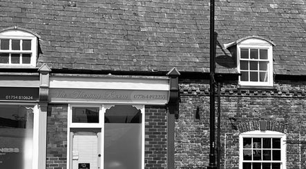 Charming facade of Skin Plus at Burgh Le Marsh, England, GB showcasing classic architecture.