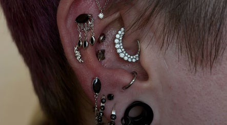 Stylish ear piercings with silver and black jewelry at Houzeofpiercing, Dublin, County Dublin, IE.