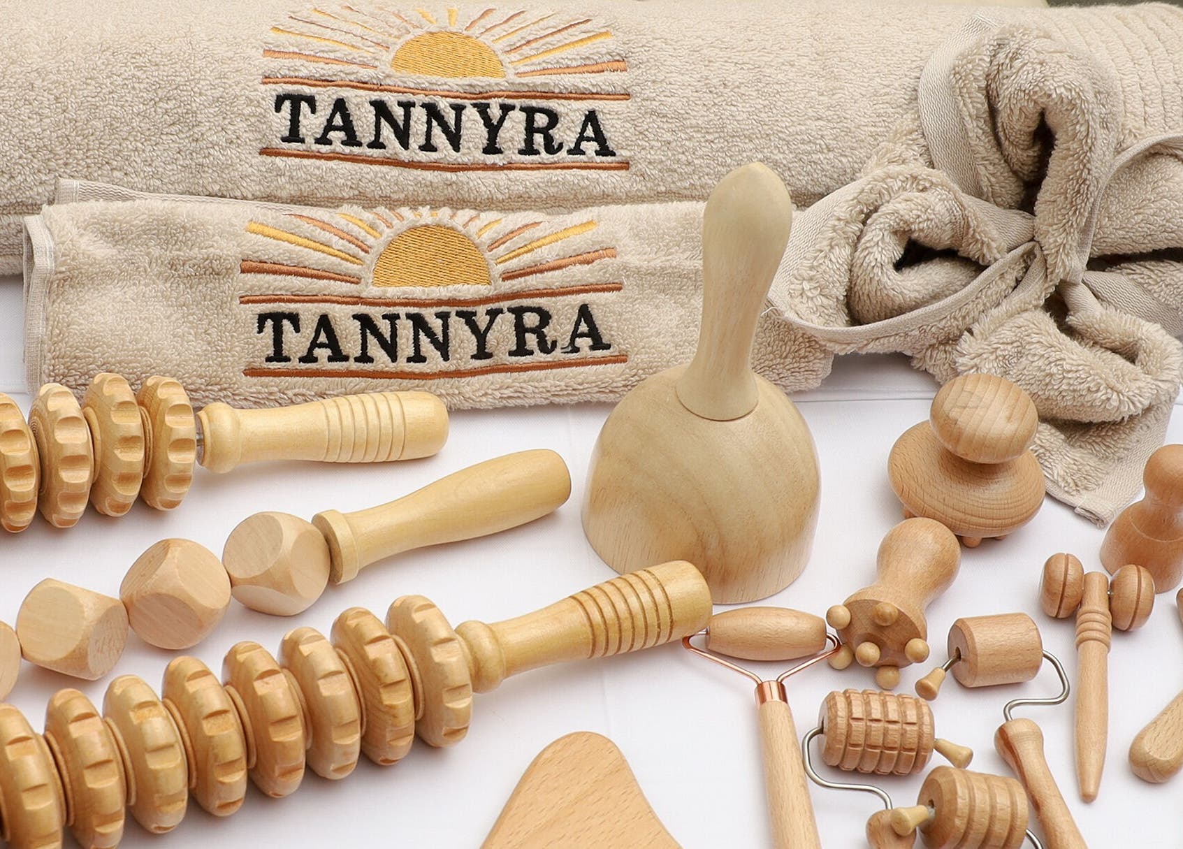 Natural wooden massage tools and Tannyra towels in Riyadh, Riyadh Province, SA showcase a wellness aesthetic.