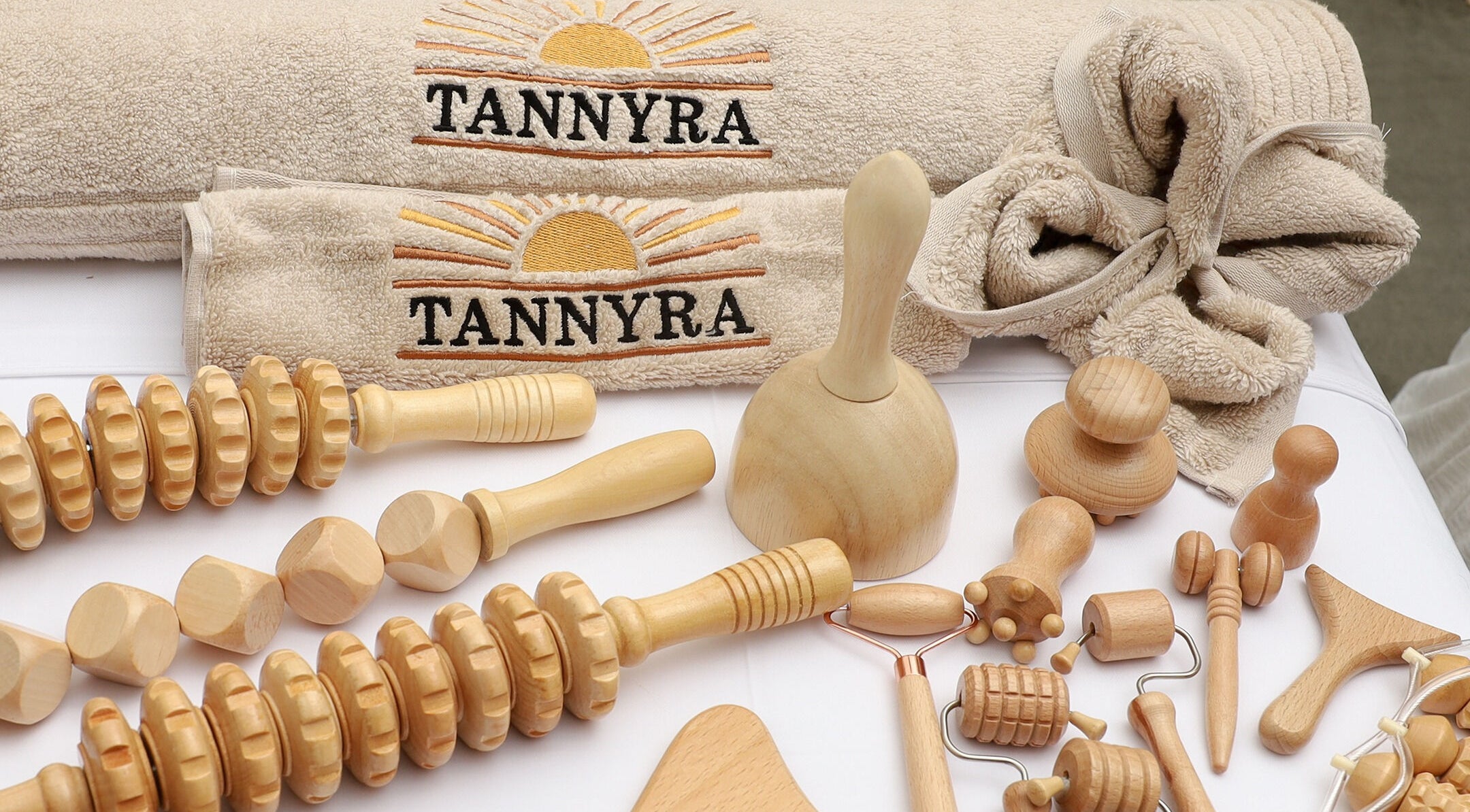 Natural wooden massage tools and Tannyra towels in Riyadh, Riyadh Province, SA showcase a wellness aesthetic.