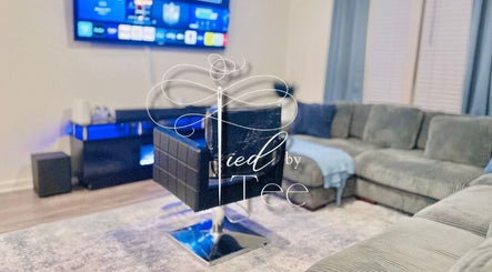 Comfortable salon chair in Tied By Tee, Macon, Georgia, US, set against a modern, cozy living area.