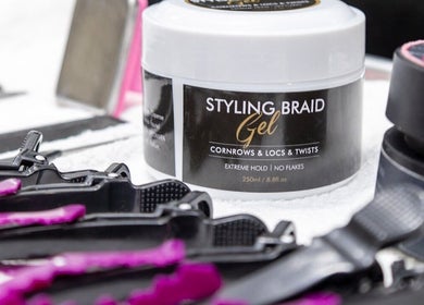 Styling braid gel on a table at BeyondBeautySami, Toronto, Ontario, CA. Ideal for cornrows and locs.