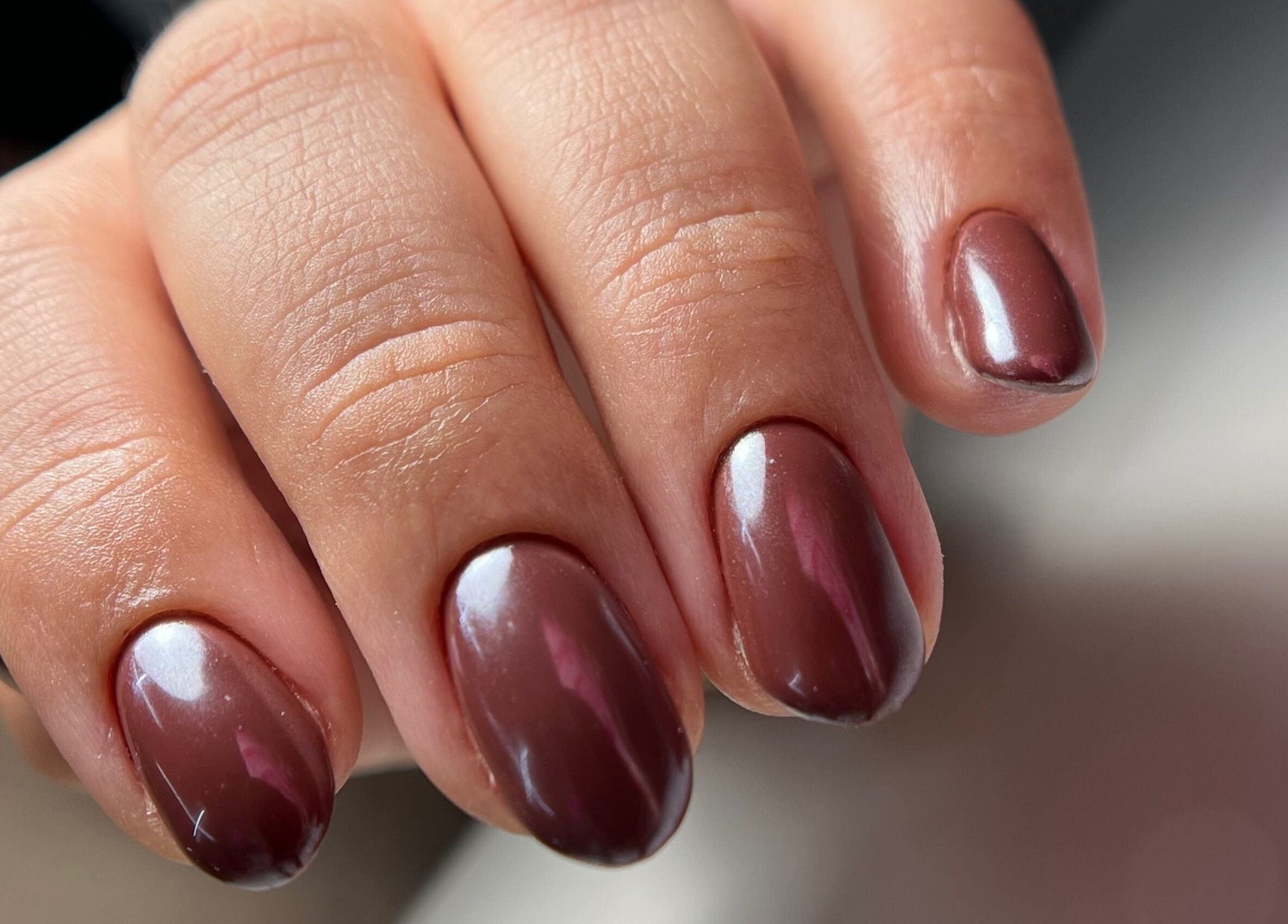 Close-up of glossy brown nails at Luxe Nails & Studio, San Juan, San Juan, PR.
