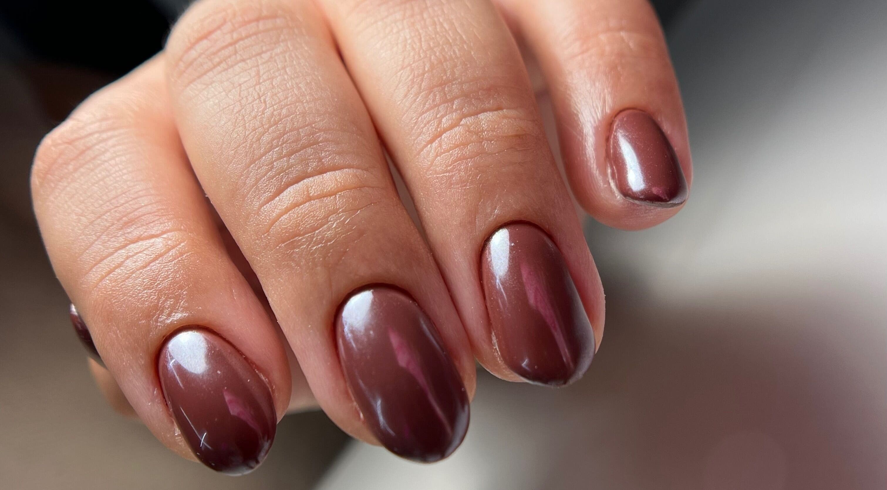 Close-up of glossy brown nails at Luxe Nails & Studio, San Juan, San Juan, PR.