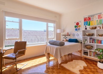 Peaceful wellness room at Wild Womb Alchemy, Melbourne, Victoria, AU with natural light and therapeutic decor.