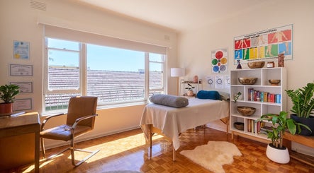 Peaceful wellness room at Wild Womb Alchemy, Melbourne, Victoria, AU with natural light and therapeutic decor.