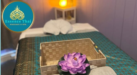Tranquil massage room at Pumy's Essence Thai Massage & Spa West End in Queensland, AU with lotus and soft lighting.