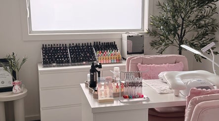 Chic nail art station at Manifest Nail Artistry, Mount Barker, South Australia, AU with polish and greenery.