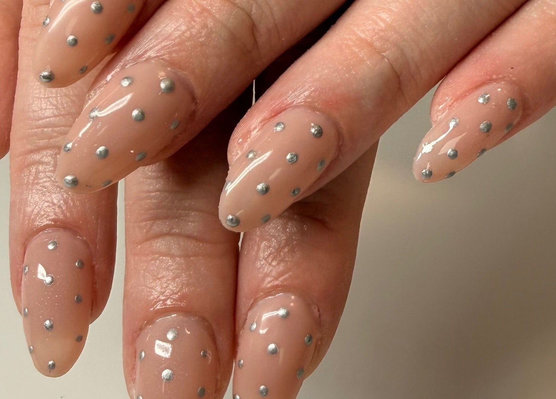 Elegant nude nails with silver dots at Manifest Nail Artistry, Mount Barker, South Australia, AU.