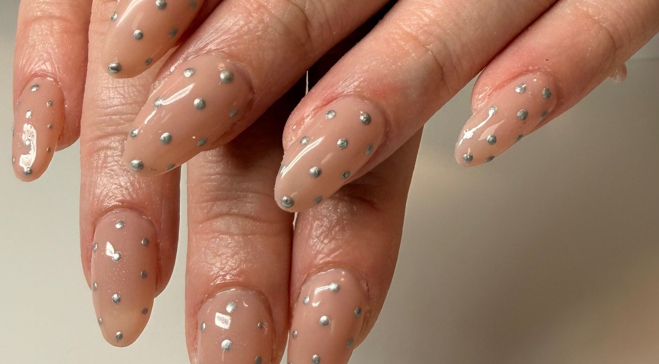 Elegant nude nails with silver dots at Manifest Nail Artistry, Mount Barker, South Australia, AU.