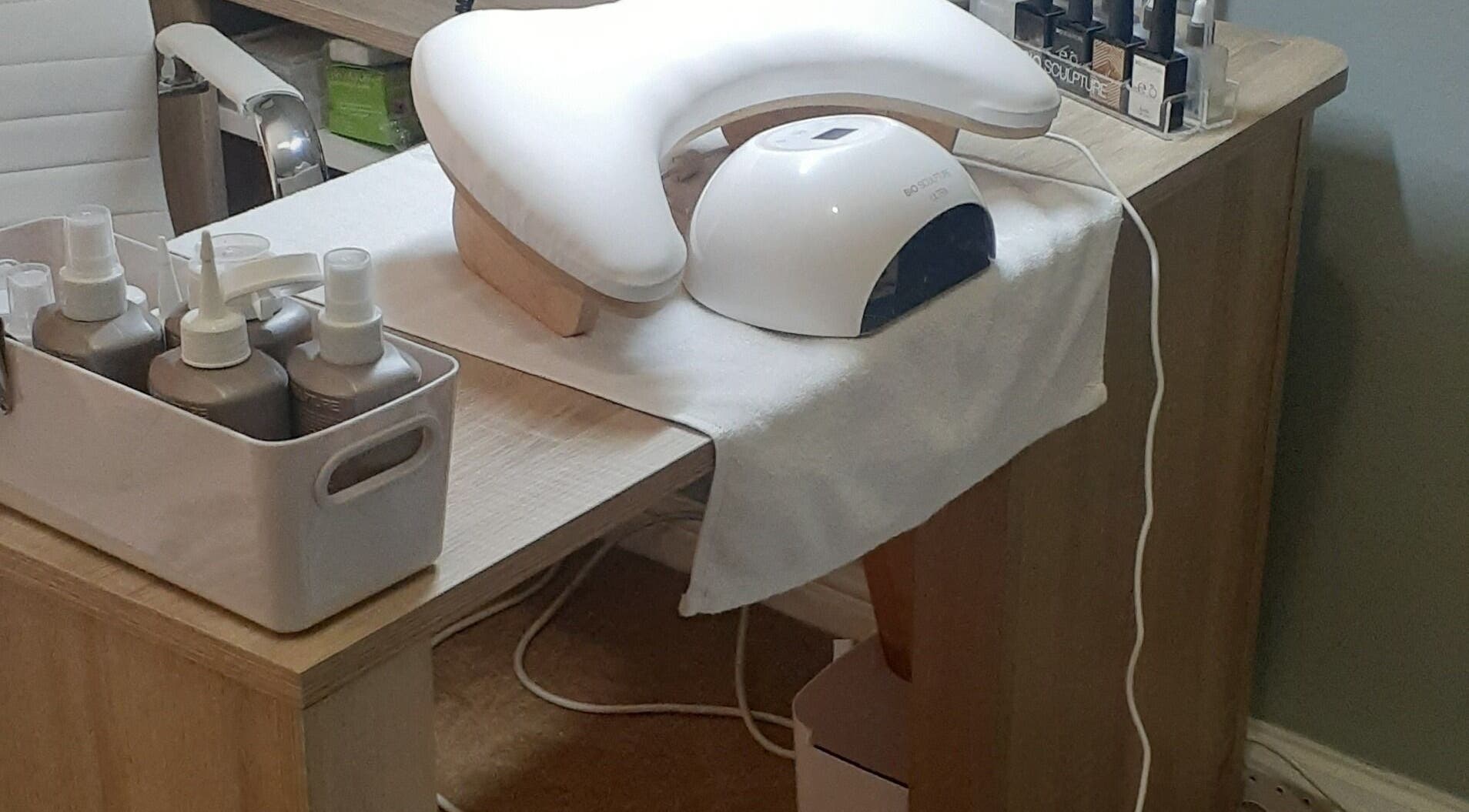 Manicure station at Luscious Nails, Cape Town, Western Cape, ZA with tools and nail polishes.