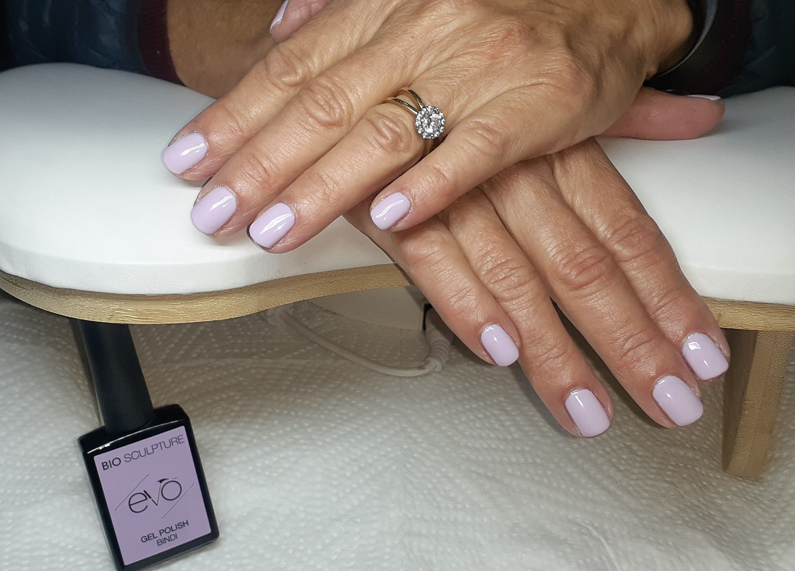 Elegant lilac nails showcased at Luscious Nails in Cape Town, Western Cape, ZA with a stylish ring accent.