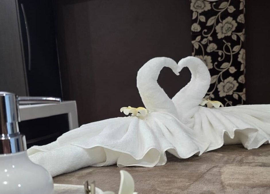 ผ้าขนหนูพับเป็นรูปหงส์ที่ PADEE THAI SPA, Cape Town, Western Cape, ZA บรรยากาศหรูหรา