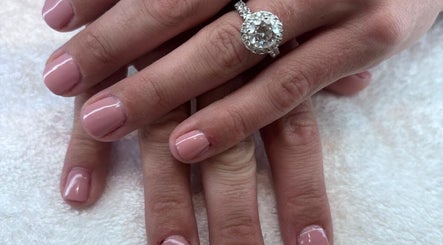 Elegant manicure with pink polish at The Nail Room Co., Birmingham, England, GB.
