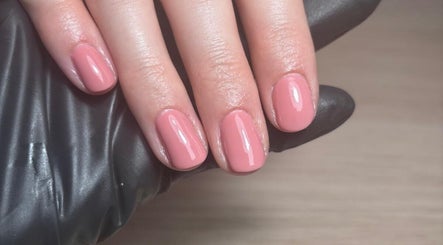 Manicured nails with rosy polish at The Nail Room Co., Birmingham, England, GB.