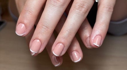 Elegant French manicure at The Nail Room Co., Birmingham, England, GB. Perfectly polished nails with a classic touch.