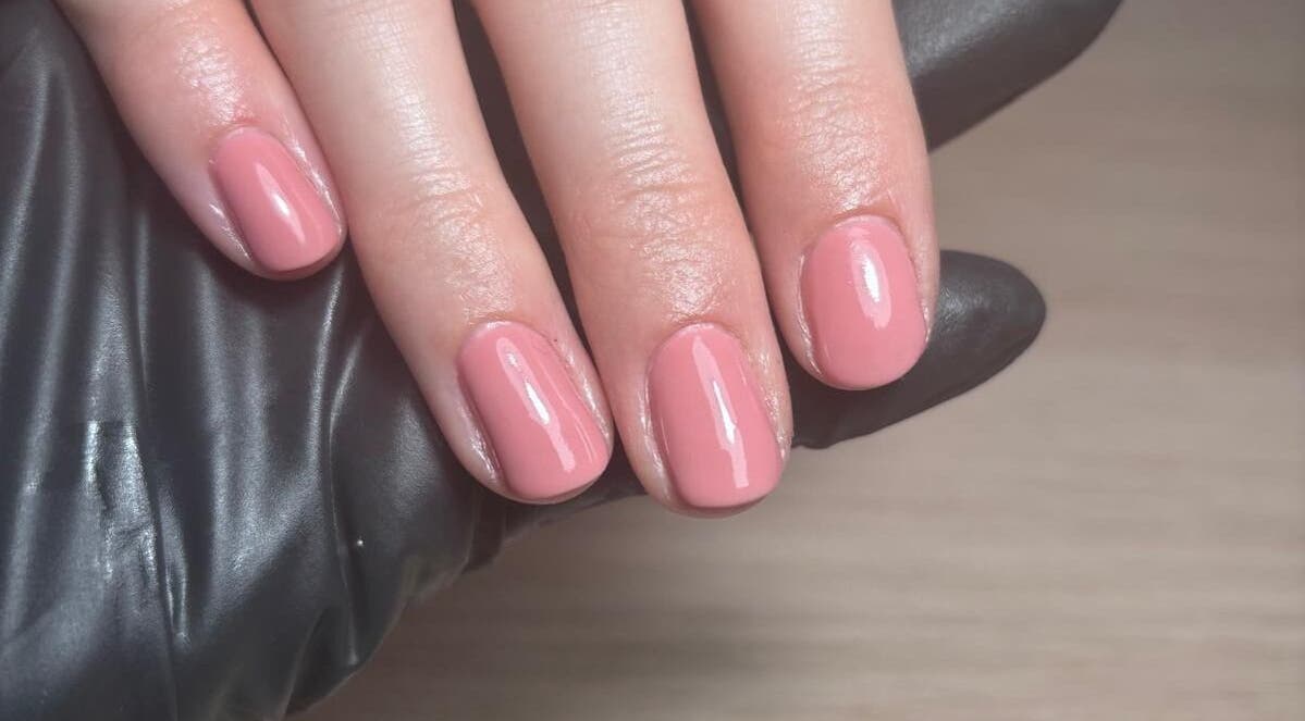 Elegant pink manicure from The Nail Room Co., Birmingham, England, GB, showcasing glossy finish.