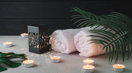 Relaxing spa setting with towels, candles at Mmmassage, Hastings, England, GB.