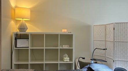 Opaline Beauty treatment room in Greenfields, Western Australia with ambient lighting and chic decor.