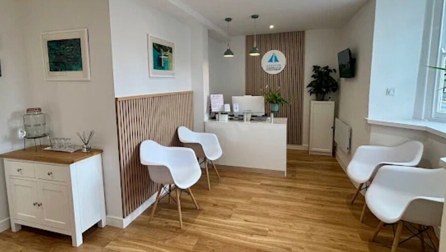 Inviting reception at Qui Yoga & Ayurveda - Topsham, England, GB with modern seating and decor.