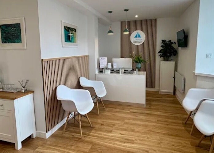 Inviting reception at Qui Yoga & Ayurveda - Topsham, England, GB with modern seating and decor.