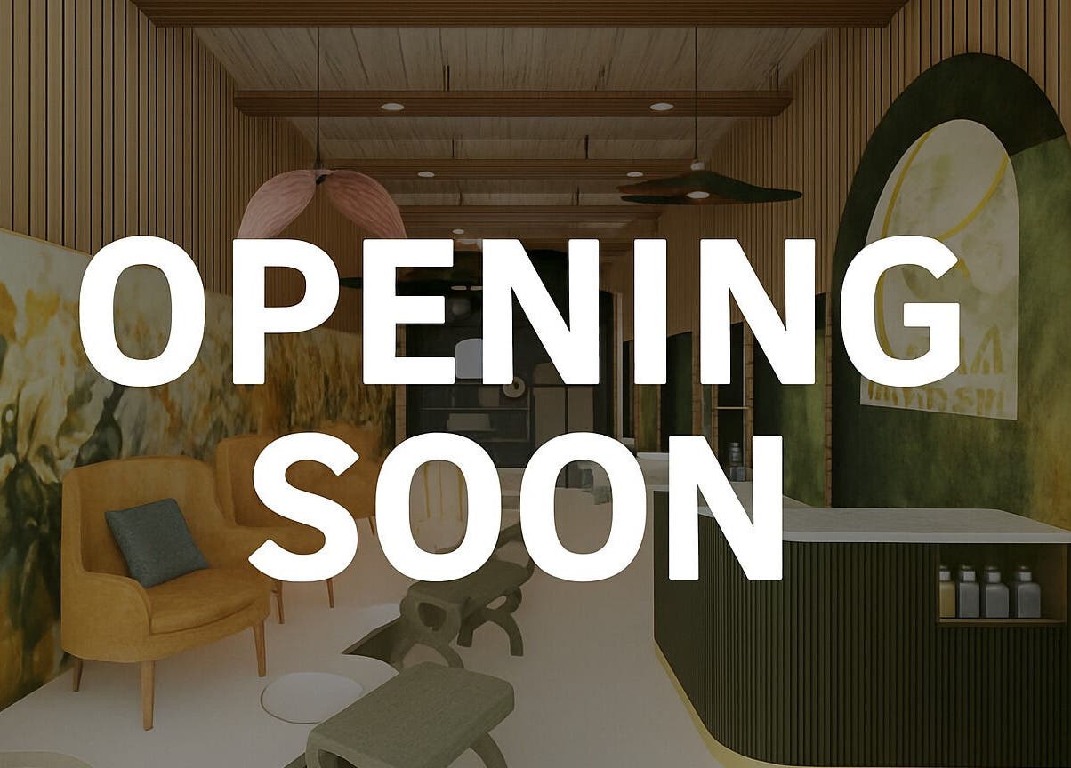 Elegant interior of AURA BEAUTY BAR in Cape Town, Western Cape, ZA, with an 'Opening Soon' sign.