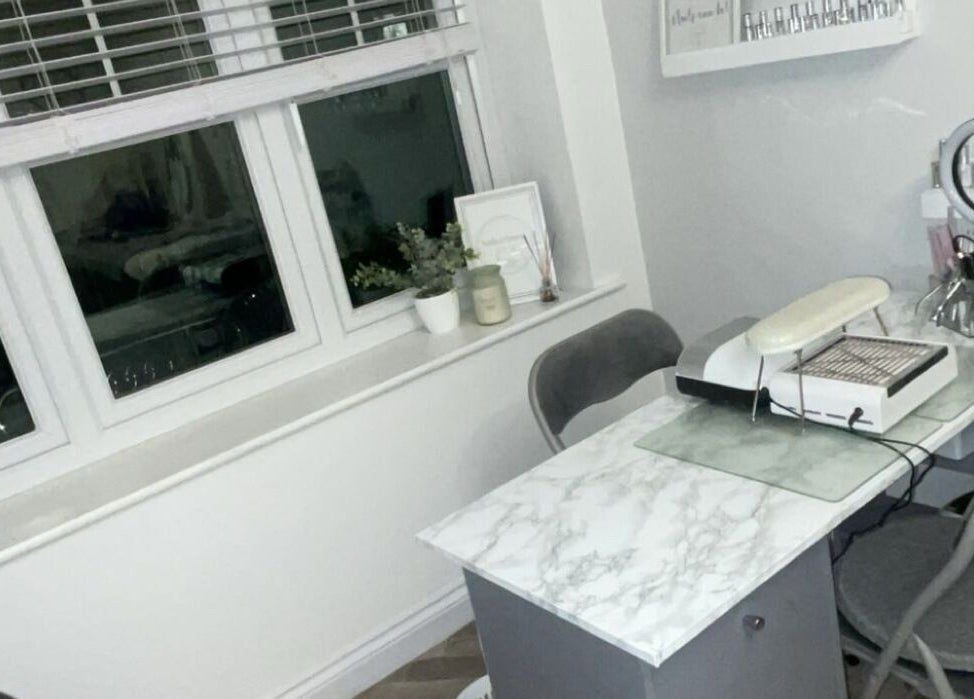Modern nail station at Nails@no5, Hartlepool, England, GB with marble desk and chic decor.