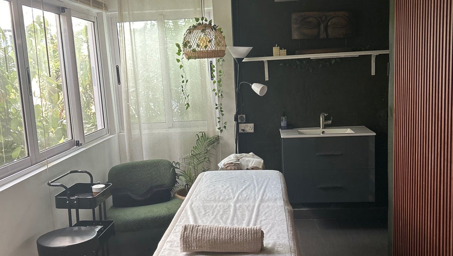 Massage room at Salon Müller in Grand Baie, Rivière Du Rempart District, MU with natural light and peaceful decor.