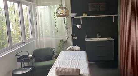 Massage room at Salon Müller in Grand Baie, Rivière Du Rempart District, MU with natural light and peaceful decor.