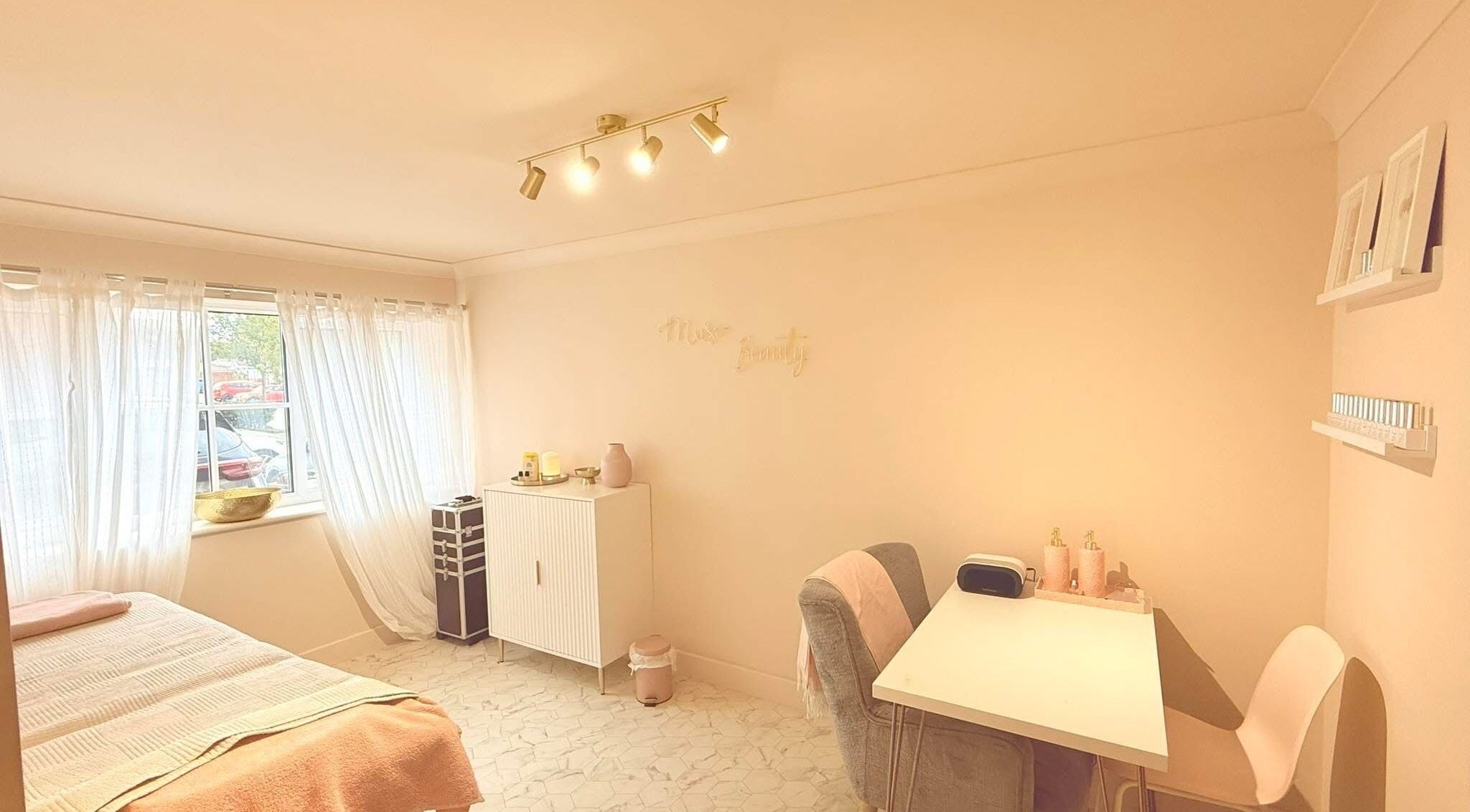 Bright and cozy treatment room at Muse Hair & Beauty in Ossett, England, GB with inviting decor.
