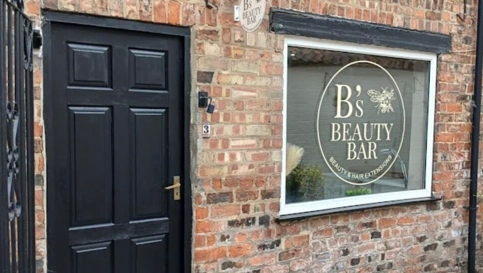 All About the Nails' charming facade in Northallerton, England, GB showing a stylish brick exterior.