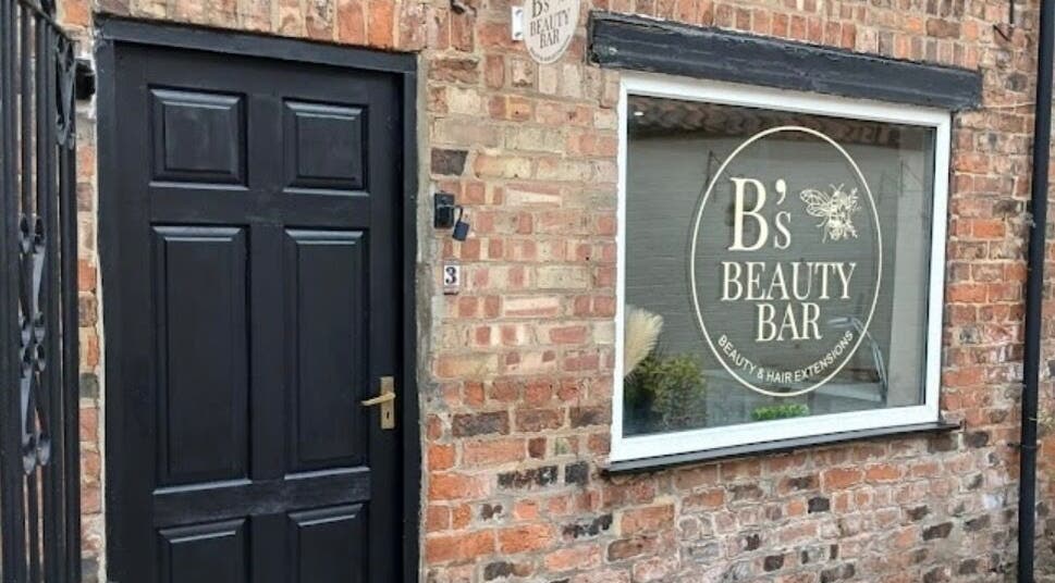 All About the Nails' charming facade in Northallerton, England, GB showing a stylish brick exterior.