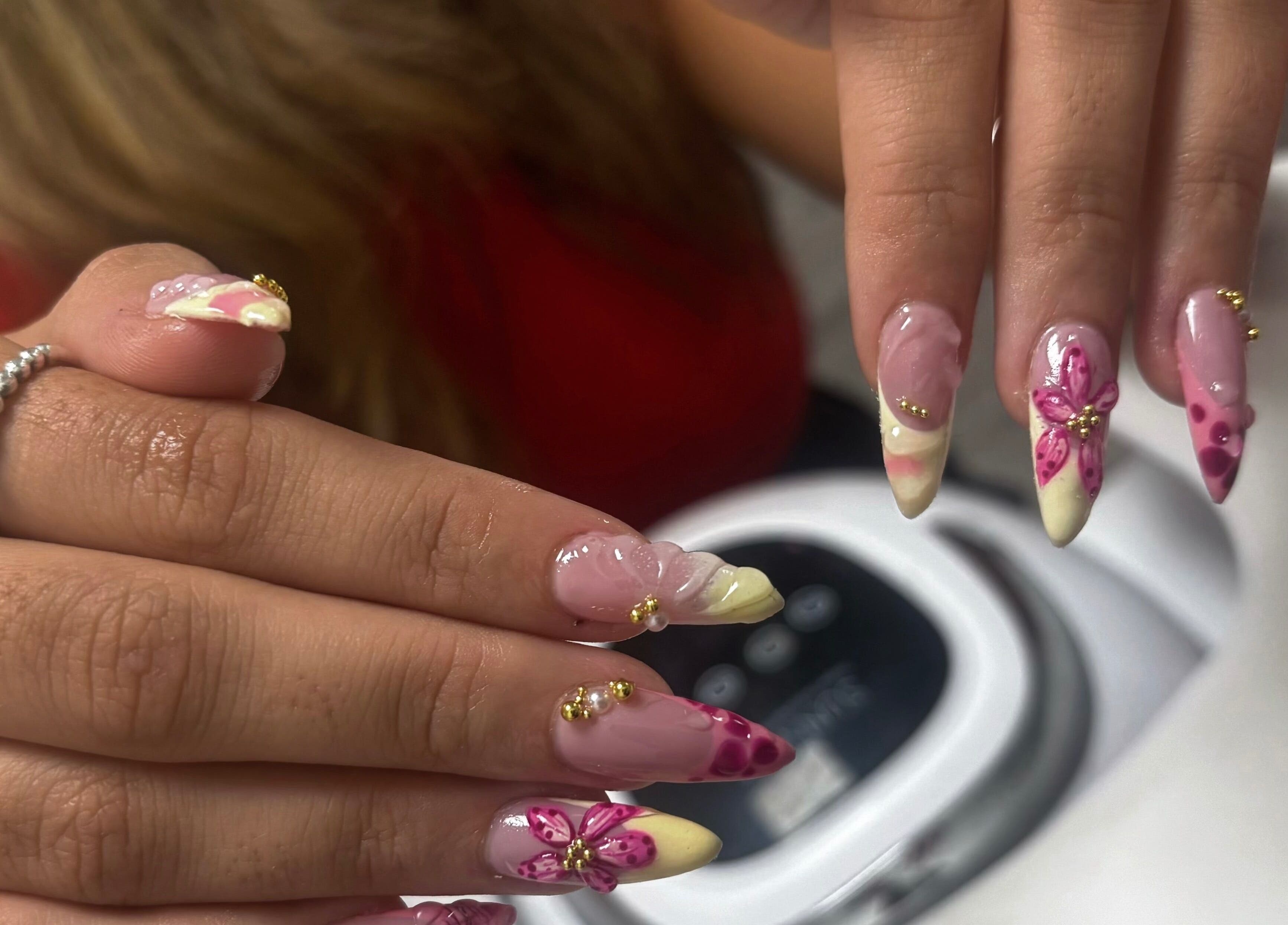 Artful nail designs at All About the Nails, Northallerton, England, GB. Features pink floral details.