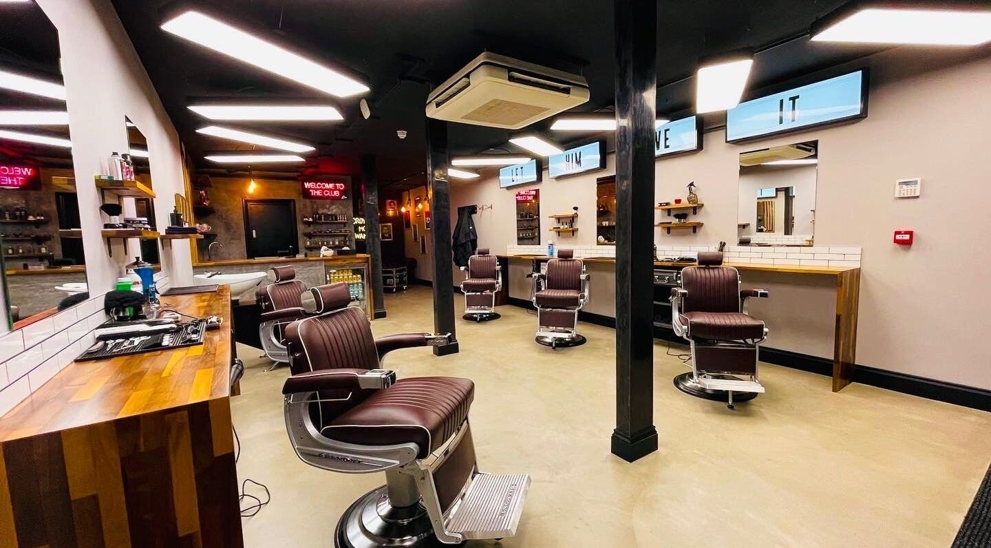 Modern interior of The Barber Club Croydon in Croydon, England, GB featuring stylish barber chairs and sleek decor.