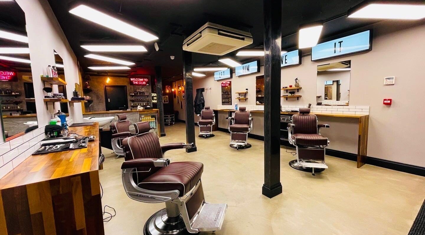 Modern interior of The Barber Club Croydon in Croydon, England, GB featuring stylish barber chairs and sleek decor.