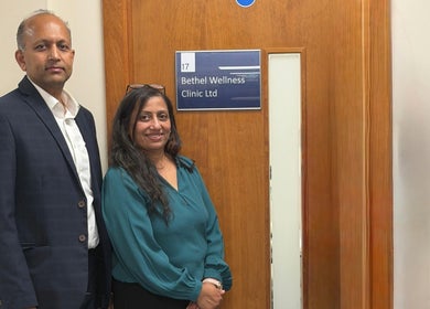 Staff at Bethel Wellness Clinic entrance, Kings Hill, England, GB, welcoming with smiles.