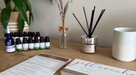 Essential oils displayed at The Wellness Pod, Woodborough, England, GB, creating a relaxing atmosphere.