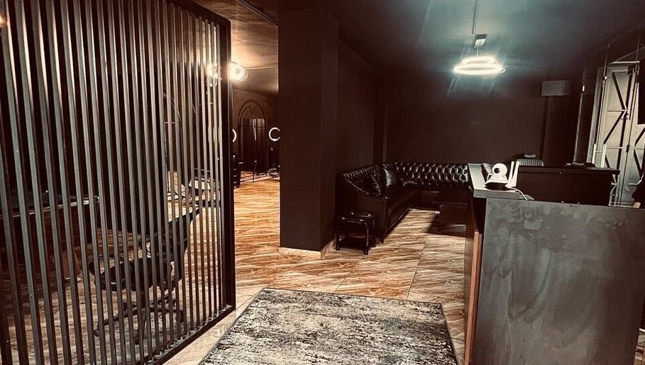 Elegant interior of Abra Kadabra, Chouifet, LB, featuring sleek dark decor and stylish seating.