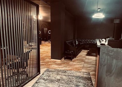Elegant interior of Abra Kadabra, Chouifet, LB, featuring sleek dark decor and stylish seating.
