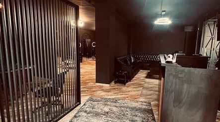 Elegant interior of Abra Kadabra, Chouifet, LB, featuring sleek dark decor and stylish seating.
