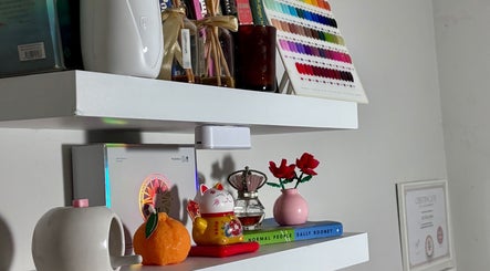 Stylish decor on a shelf at Lunelix Studio, Daerah Khusus Ibukota Jakarta, showcasing beauty and wellness items.