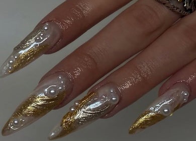 Stunning golden and pearl nail art at IB NAILZ, Edinburgh, Scotland, GB. Elegant manicure design showcase.