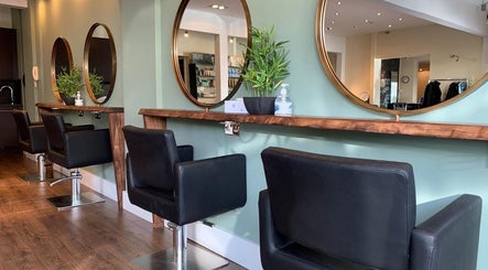 Elegant styling stations at Hair By Karolina, Bolton, England, GB offer a modern and cozy atmosphere.